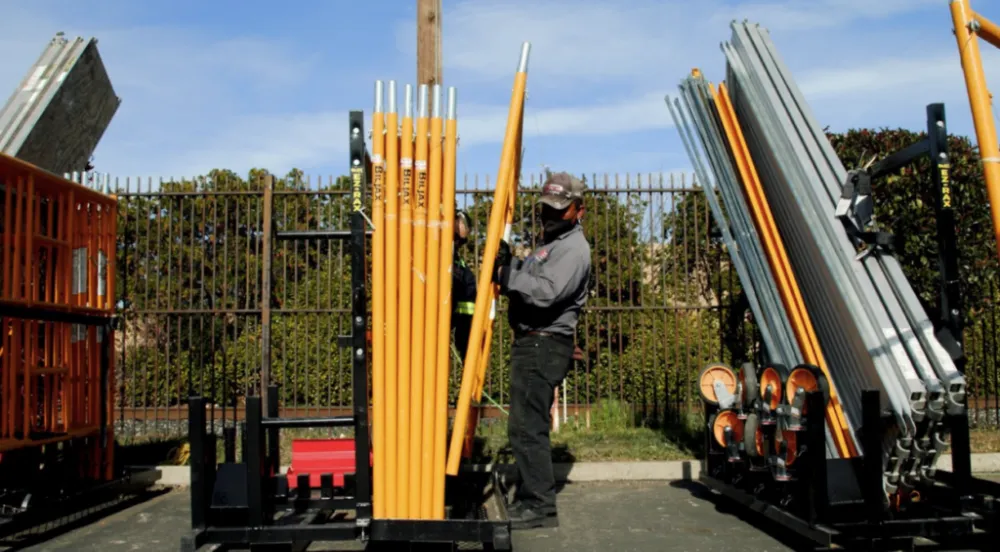 A worker unloads Bil-Jax’s Pro-Jax Utility Scaffold.